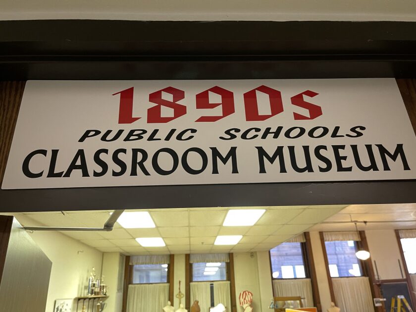 A sign reading 1890s public schools classroom museum