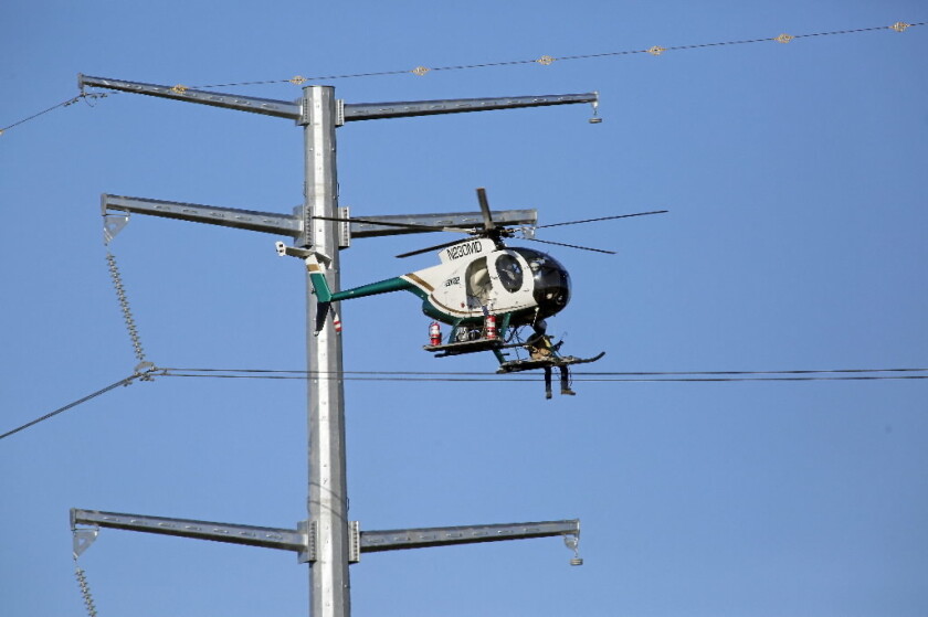A high-wire act: Taking a ride installing power lines - InForum | Fargo ...