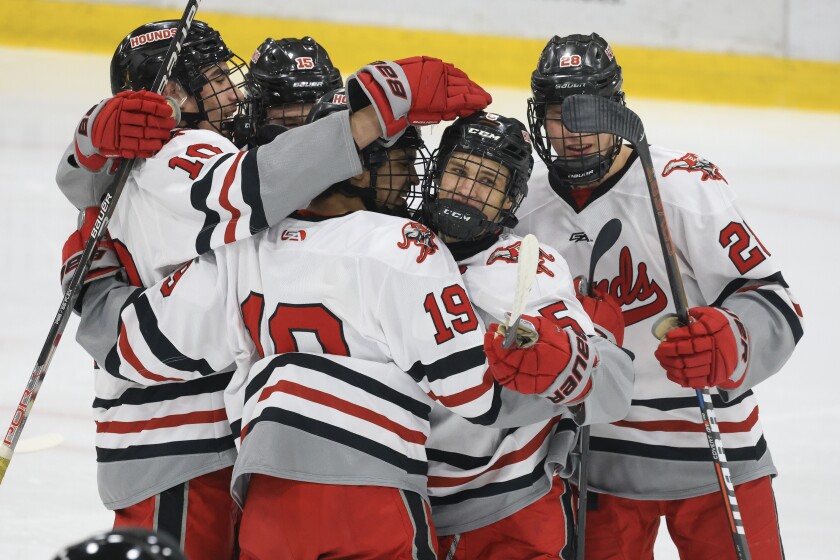 high school boys play ice hockey