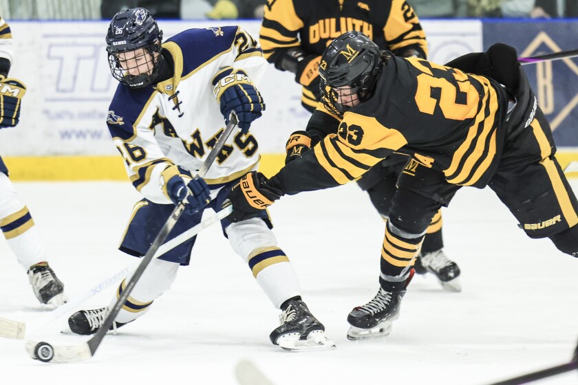 high school boys play ice hockey