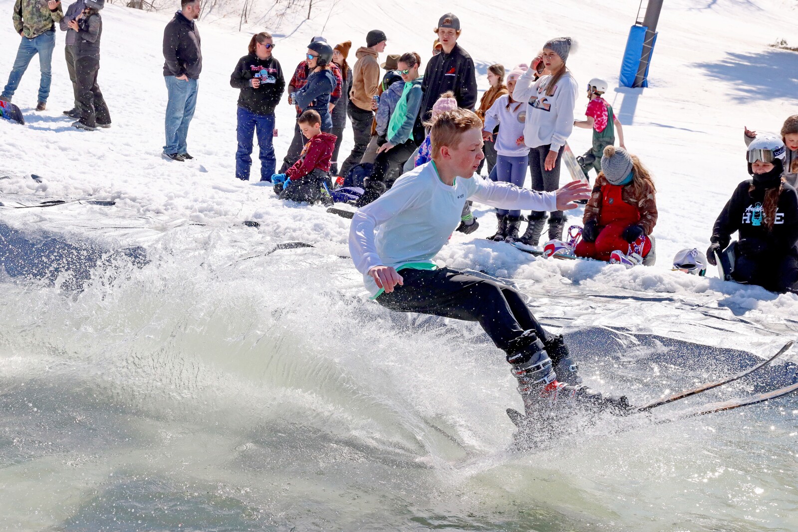 Skiers and snowboarders participate in the water skip at Mount Ski Gull on Saturday, April 8, 2023, for the end of the season.