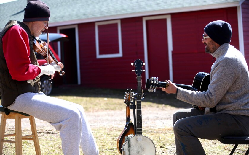 two men playing music