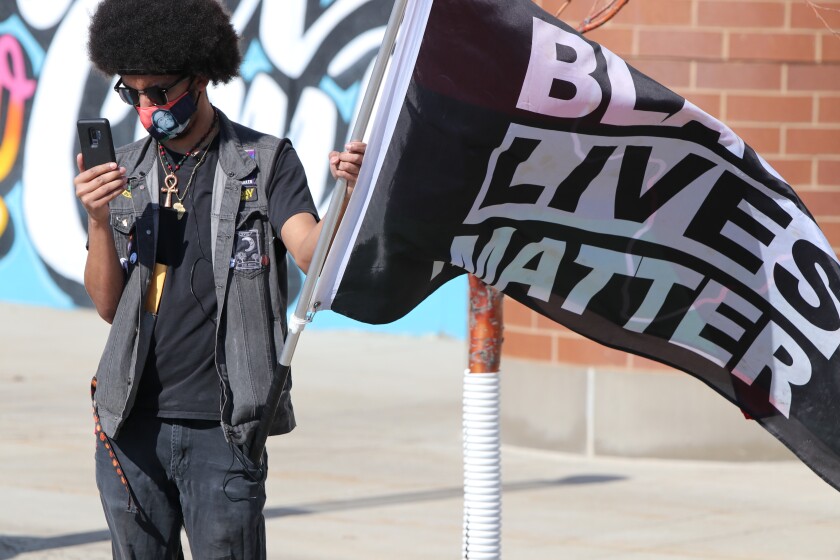 Avalon Fyreheart, Fargo activist and an organizer with the Red River People Over Profits Initiative, participates in the Justice for George Floyd Solidarity Rally on Sunday, March 7.jpg