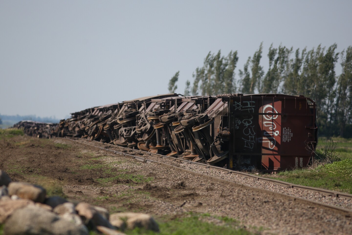 Railroad cars turned over, as seen on Monday, June 23, 2025, east of Page, ND, and north of Erie, ND, from a storm on June 20.