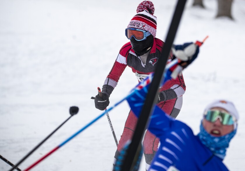 Willmar skier Timothy Halvorson avoids skiing into Brainerd's Zachary Schaeffer