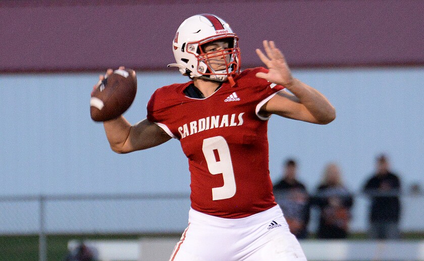 Willmar junior Cullen Gregory sets to fire a pass during a North Central White District game against Delano on Friday, Sept. 30, 2022 at Hodapp Field.