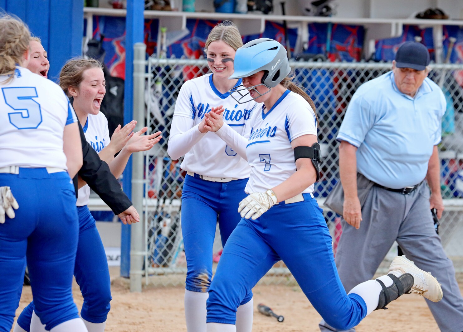 Brainerd's Olivia Tautges and the team celebrate a home run against Forest Lake on Friday, May 20, 2022, in Brainerd.