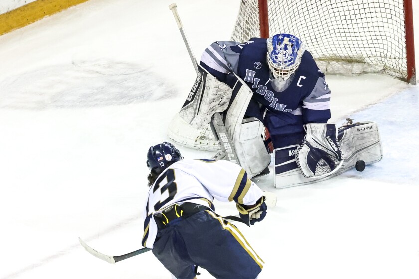 high school boys play ice hockey