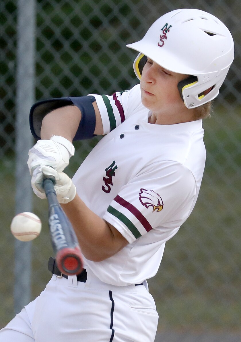 Northwood/Solon Springs' Tanner Carlson (7) makes contact with the ball