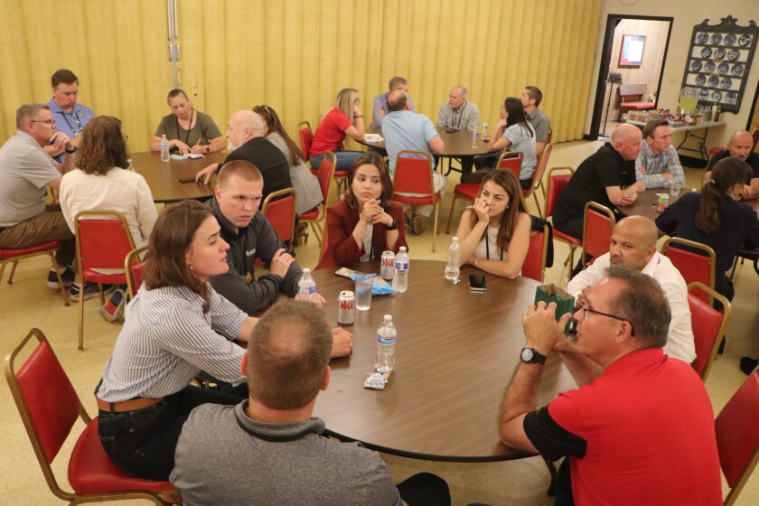 A woman who works for Nori speaks to ag experts about carbon credits.