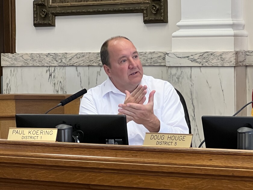 Commissioner Paul Koering gestures while speaking