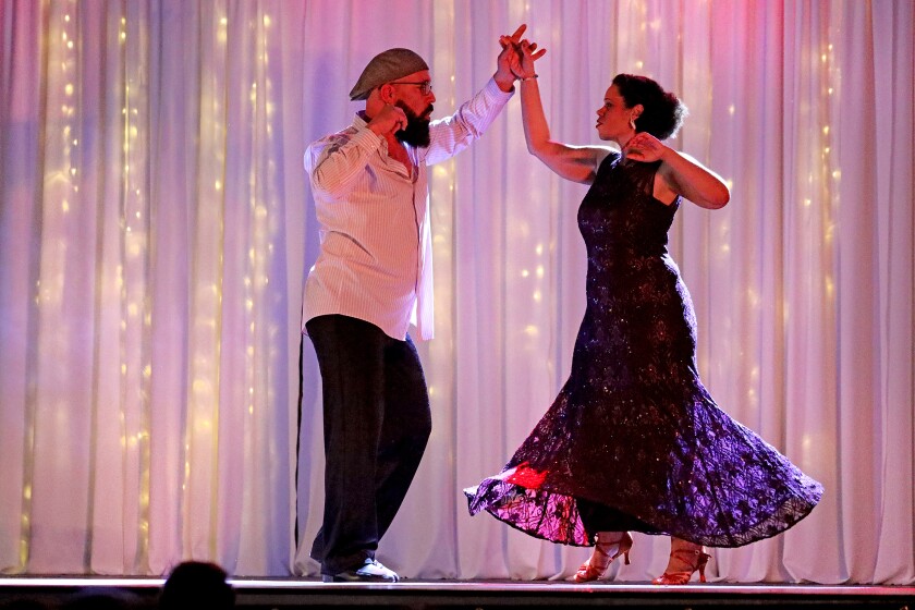 Dancer perform on stage.