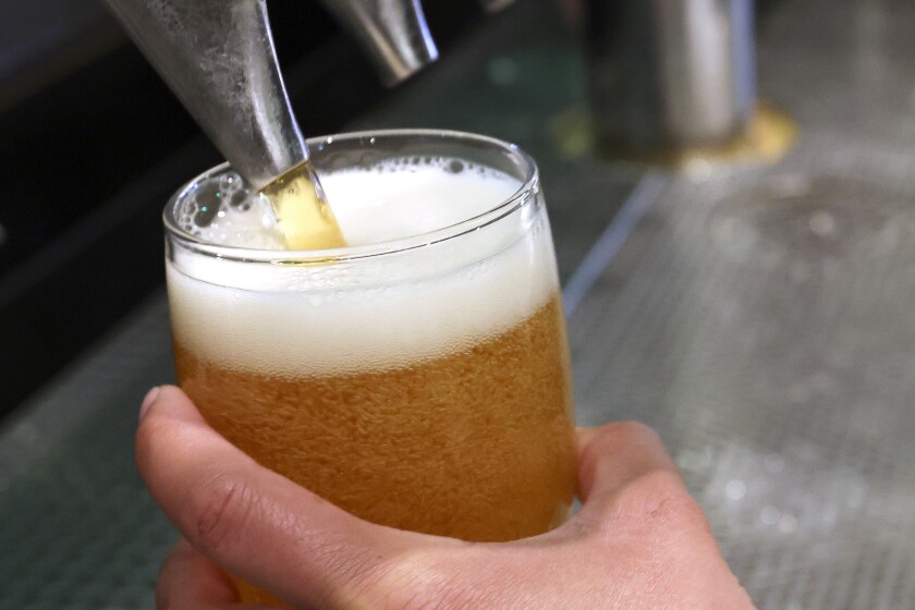 A beer being pulled.