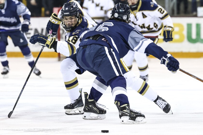 high school boys play ice hockey