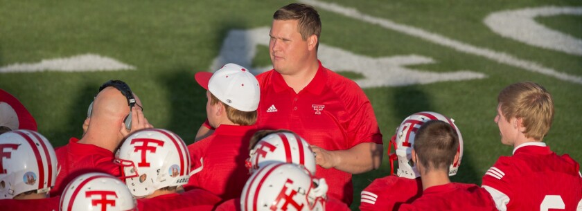 Dickinson Trinity head football coach John Odermann stands on the sidelines during his team's game against Killdeer on Aug. 25, 2016, at the Biesiot Activities Center. (Courtesy Photo by Eric Olheiser)