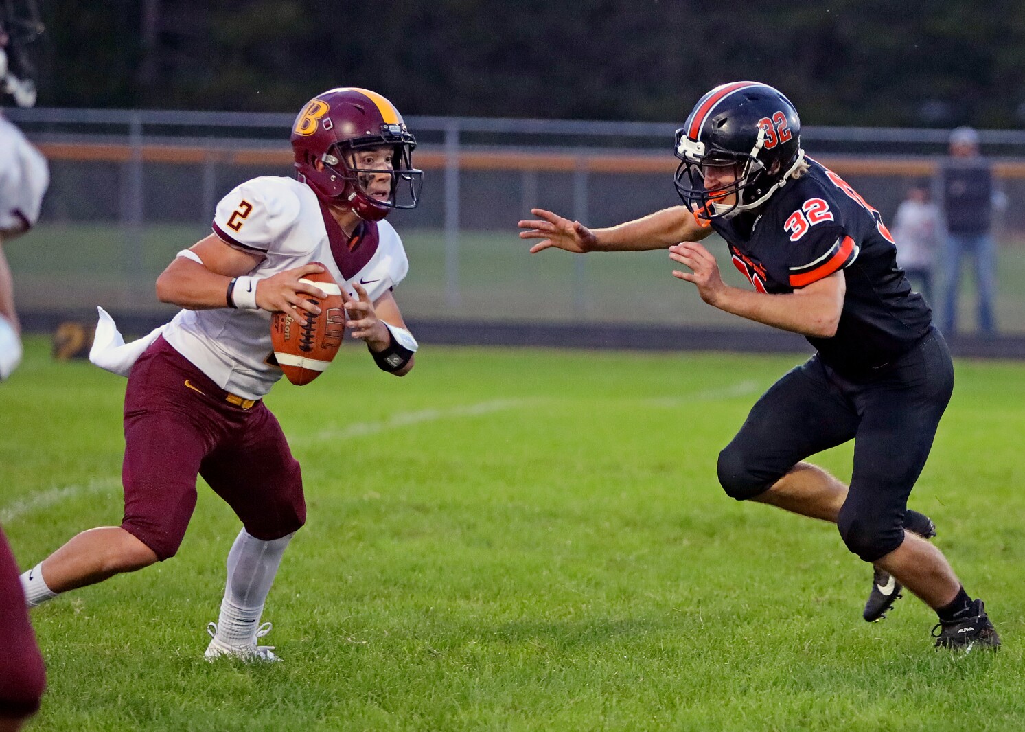 Pine River-Backus football player rushes Bagley quarterback.