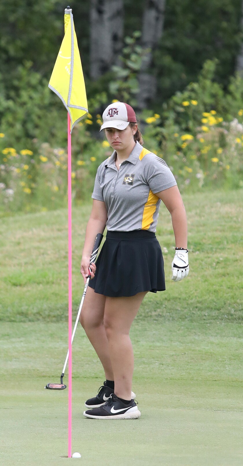 Northwestern’s Katie Kyle watches her put fall into the cup