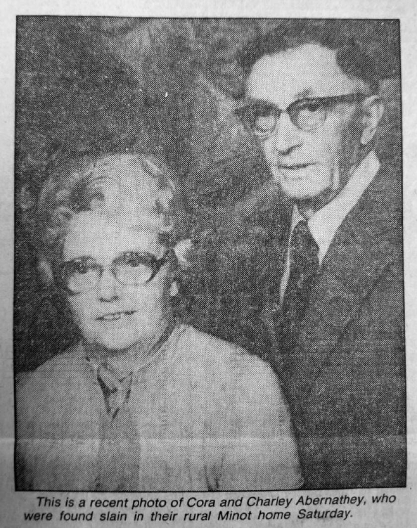 Newspaper clipping of a photo of a married couple with a caption below.