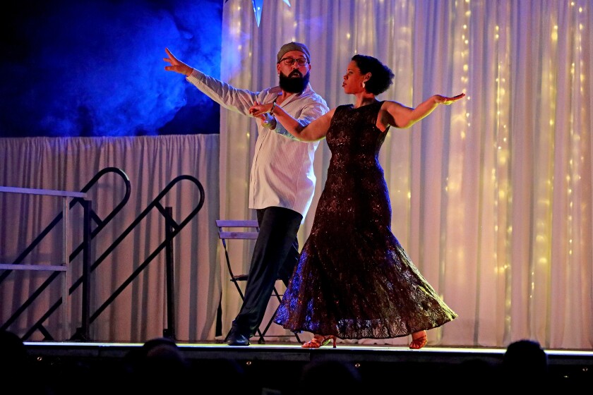 Dancer perform on stage.