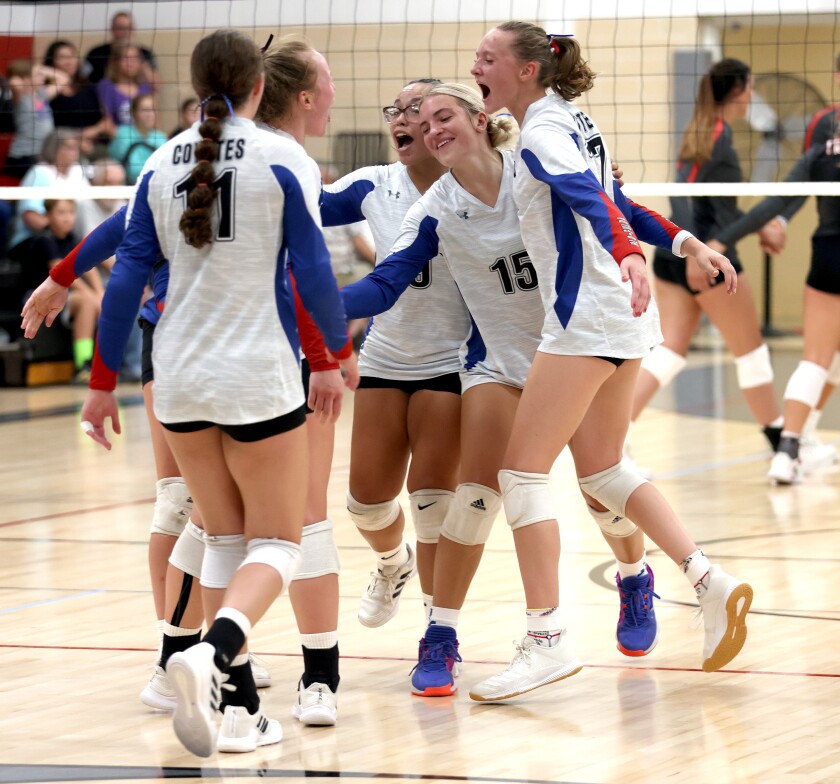 Heron Lake-Okabena/Fulda Coyotes celebrate taking the lead in the first set of the volleyball season opener against visiting Worthington Trojans Thursday evening (from left) Marissa Becker, Samantha Untiedt, Lili Nielsen, Anna Fest andMarenna Bang.