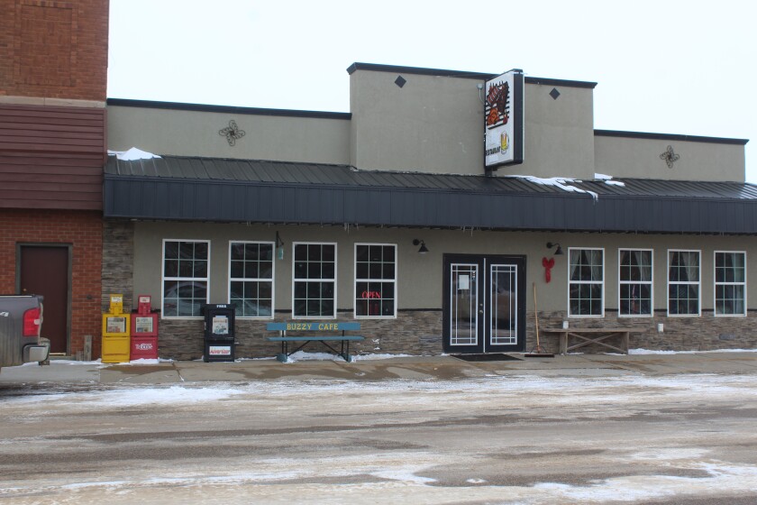 The Buzzy Cafe in Beach adds value to its business by putting a noticeable bench out front. Signs, benches and flags are all ways businesses can drum up more walk-in patronage. (Iain Woessner/The Dickinson Press)