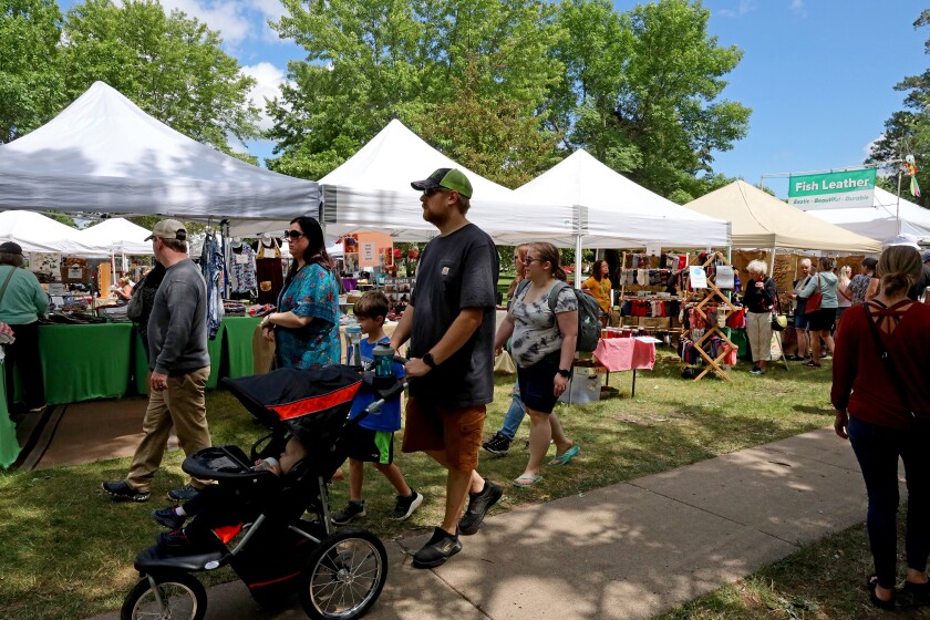People attend Arts in the Park on Sunday, June 26, 2022, at Gregory Park in Brainerd.