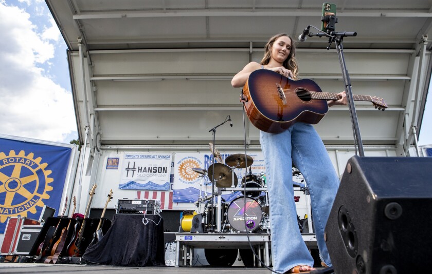 Ava Hanson pauses before starting a new song while playing at the first Rockin' Robbins event of the summer season at Robbins Island Regional Park on Tuesday, July 12, 2022.