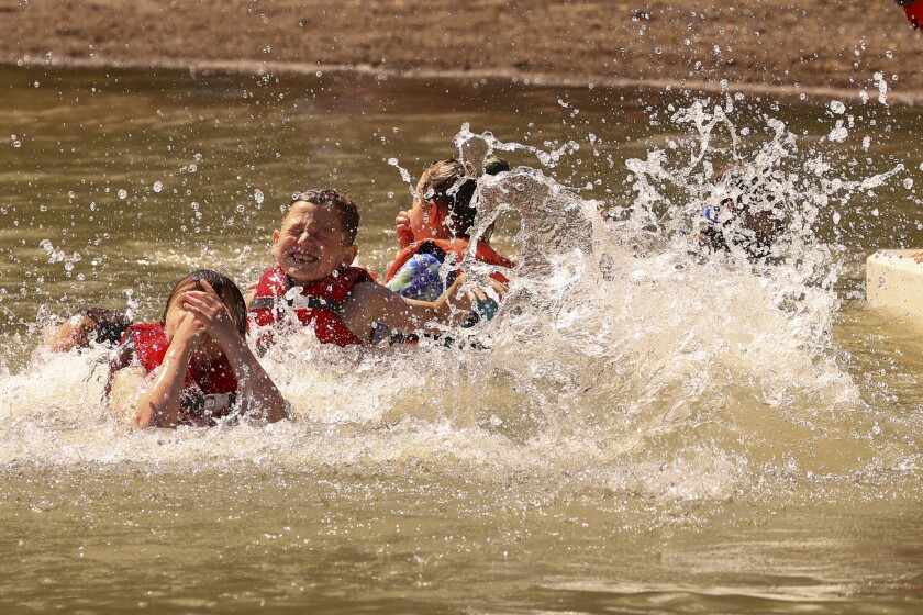 Children playing and swimming at the beach