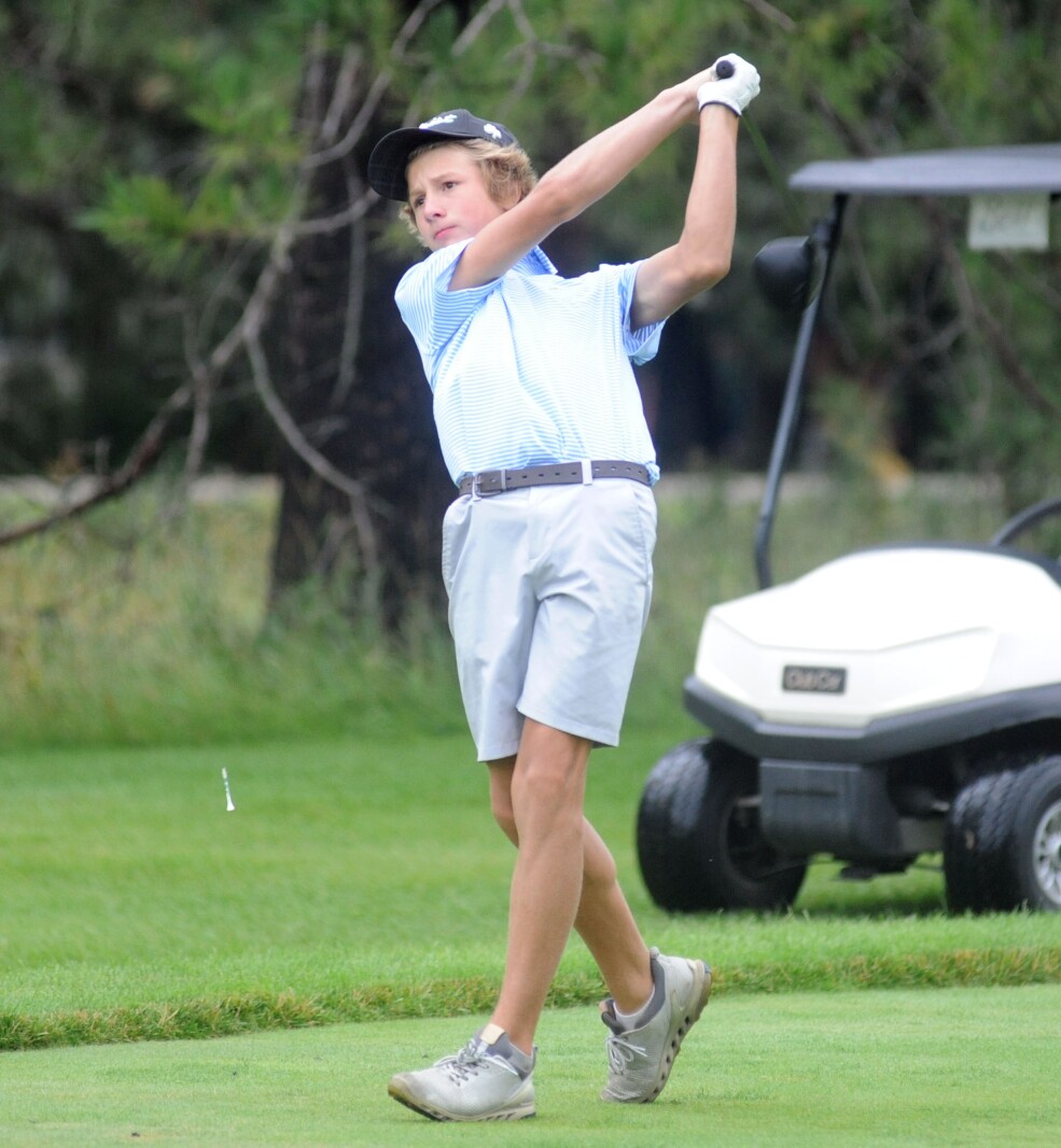 Henry Buttweiler smashes a drive on the par 4 11th green at the