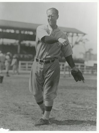 Leslie Ambrose Bush throwing a baseball in uniform