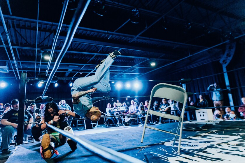 The wrestlers perform at a Timebomb Pro Wrestling event