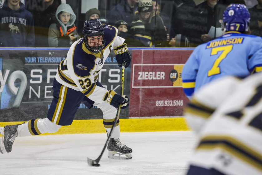 high school boys play ice hockey