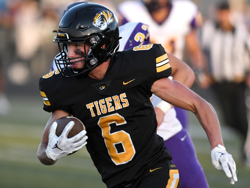 Northwestern’s Tanner Kaufman (6) takes off for the end zone after scooping up an Ashland fumble