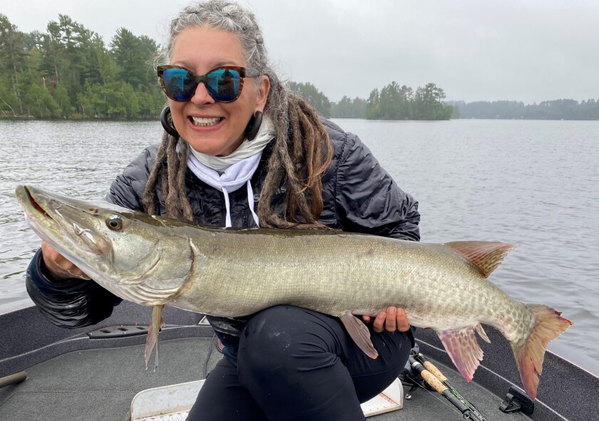 Karen <cTavish and a 44.5 inch muskie on Lake Vermilion