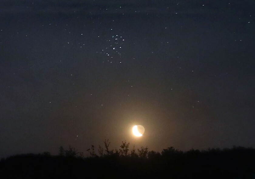 Pleiades and moon