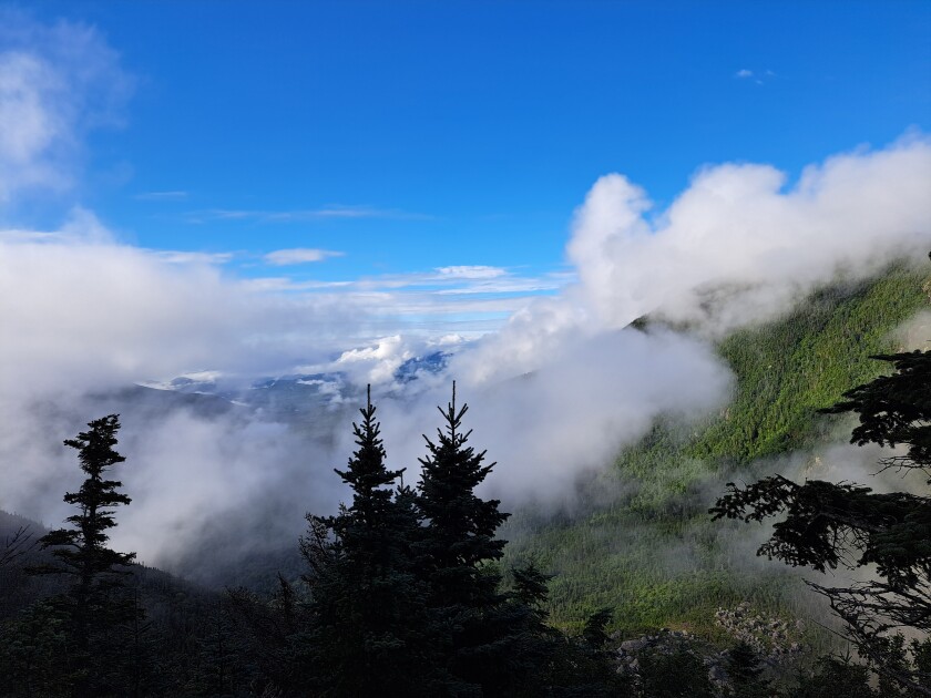 Low clouds surrounding mountains