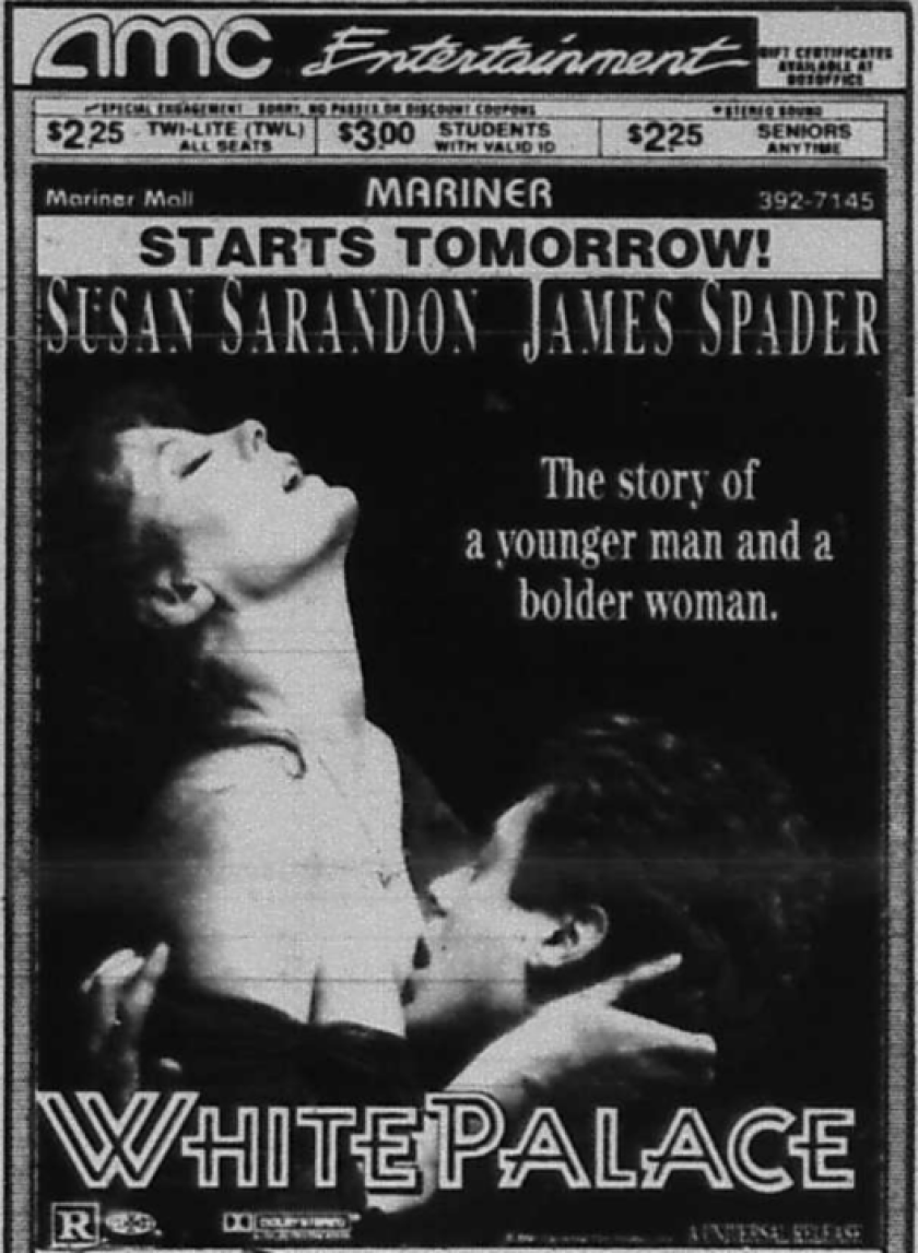 A man kisses the chest of a woman in an advertisement for the movie "White Palace"