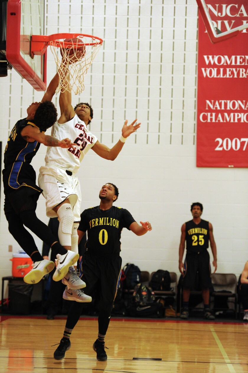 CLC Raider Lowell Griggs battles to make the shot against the Vermilion Ironmen Wednesday night at Central Lakes College. (Brainerd Dispatch/ Steve Kohls) Gallery