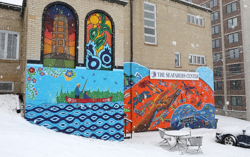 A mural titled Aanjibimaadiziwag Manidoonsag by Moira (Miri) Villiard, Michelle Waabanangagokwe Defoe, Heather Olson and Aurora Webster can be seen on the wall at the Seafarers Center as snow falls Wednesday morning
