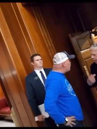 PHOTO: NDGOP District 40 chairman and "We the People" rally organizer Jay Lundeen shouts in the face of Senate Majority Leader Rich Wardner