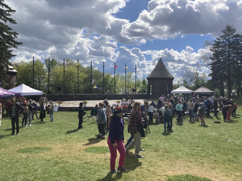 Community members gather in a park.