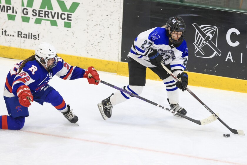 high school girls play hockey