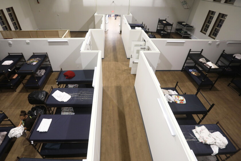 An overhead of sleeping quarters containing bunk beds and mattresses.