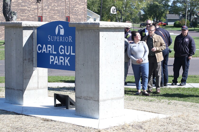 Superior City Councilor Jenny Van Sickle, left, chats with Superior Mayor Jim Paine after the sign unveiling at Carl Gullo Park