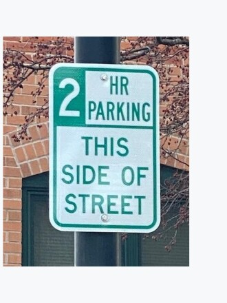 A sign reading, "2 hour parking, this side of the street."