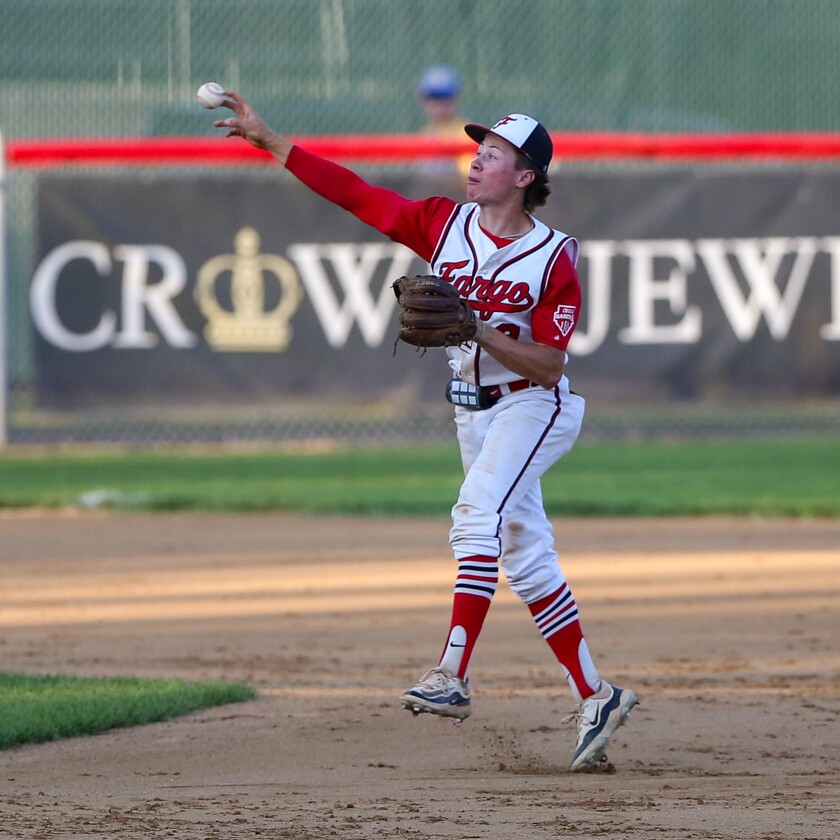 Fargo Post 2's Caleb Briggeman fields a ground ball and makes a throw to first base for an out against Thief River Falls Post 117 on Friday, June 27, 2025, at Jack Williams Stadium in north Fargo.