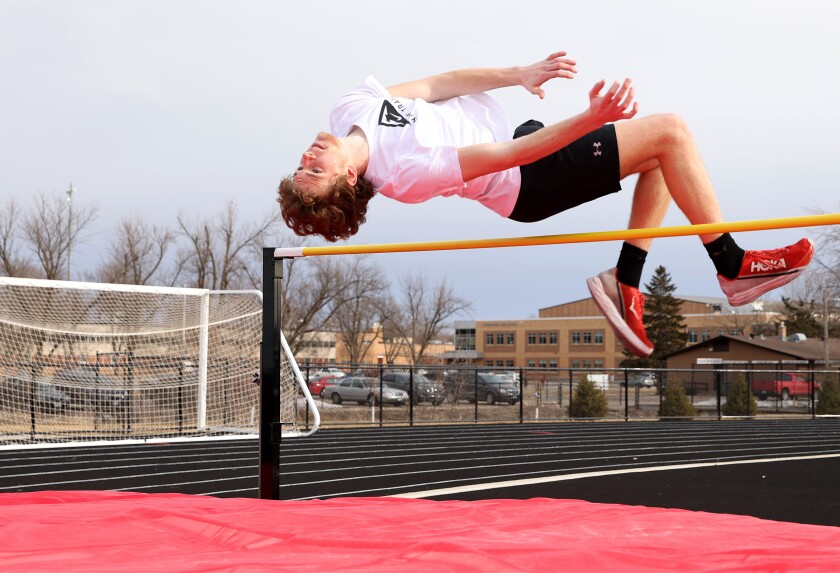 Worthington Trojans track and field athlete Charles Brands leaps over the high jump bar during his first jump of the season.