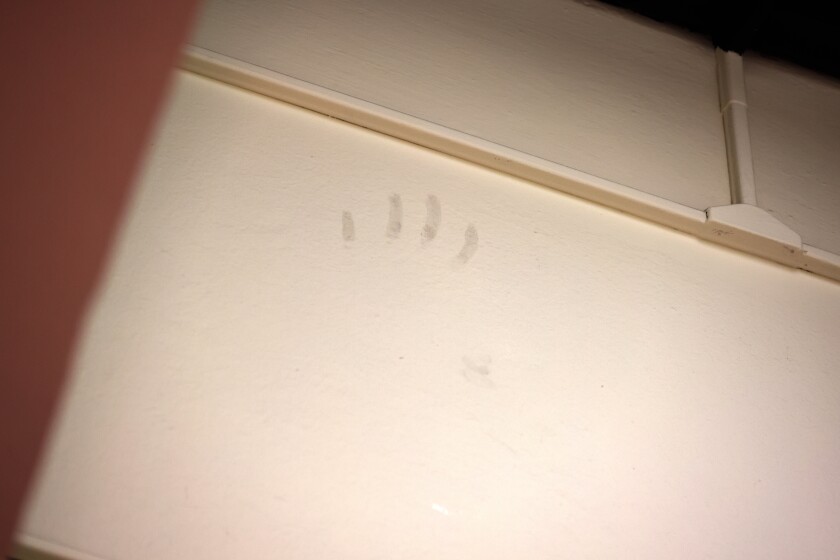 Mysterious hand print on wall