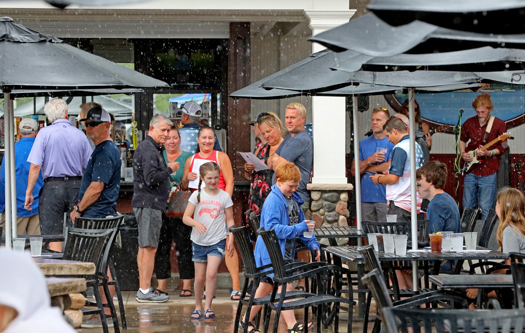 People seek shelter from a sudden rain shower