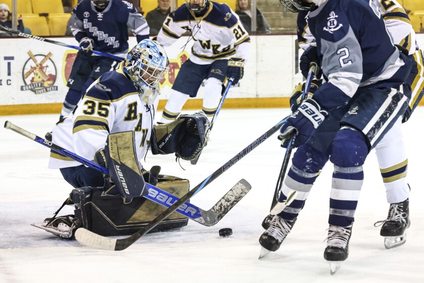 high school boys play ice hockey